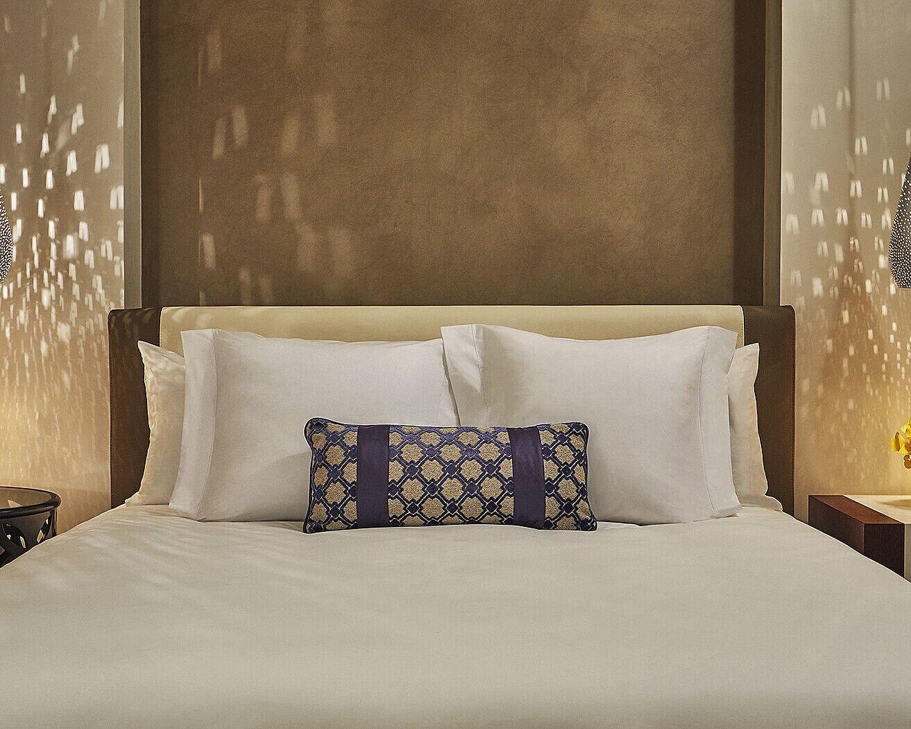 Four Seasons Hotel Casablanca Exterior photo A bed with two pillows
